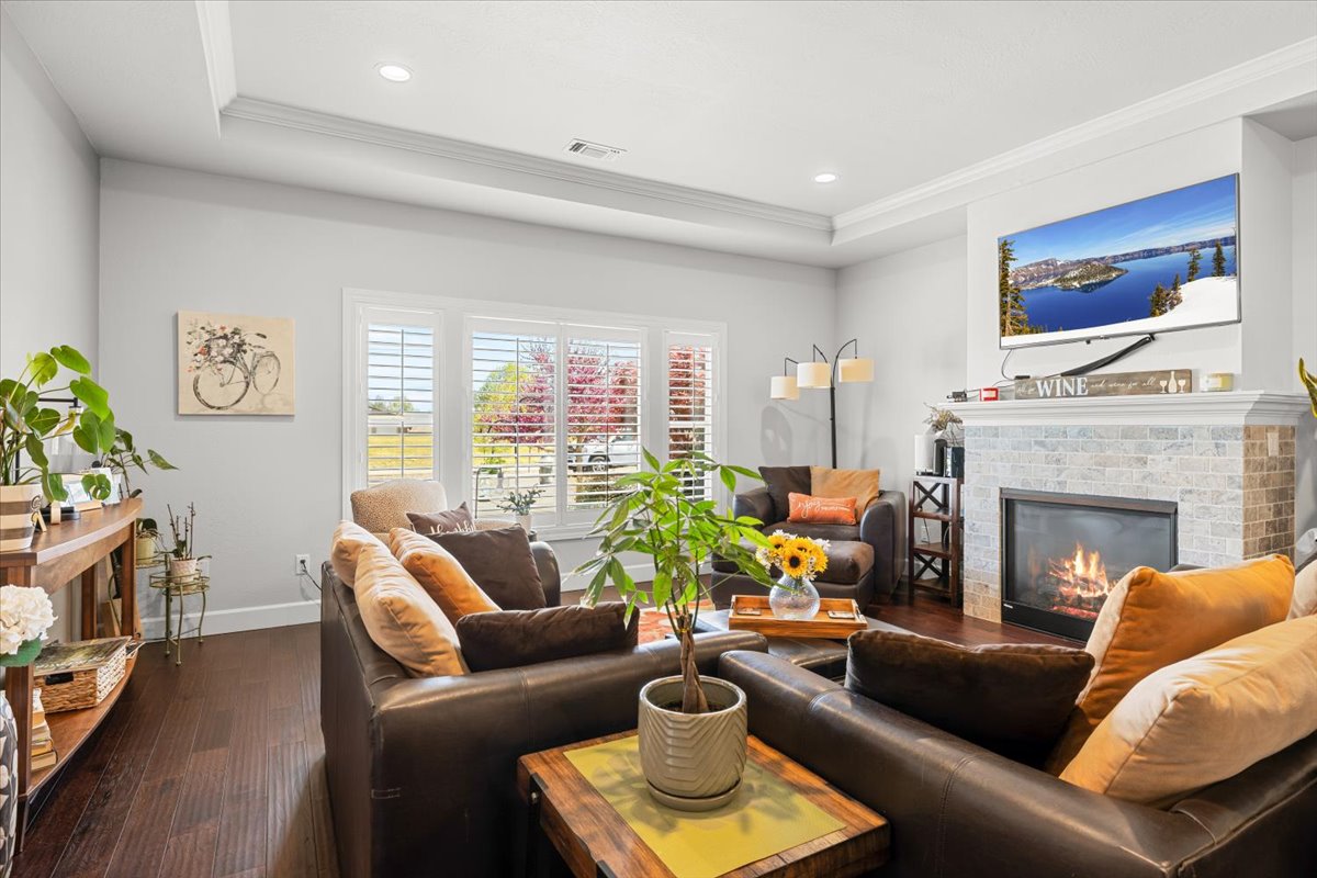 Living room with a fireplace and large windows